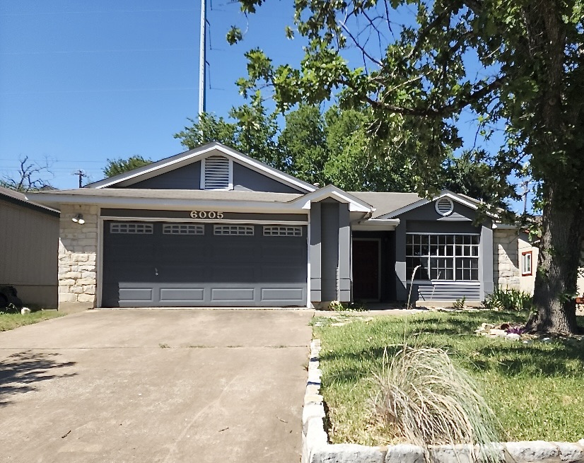 6005 Avery Island Avenue Austin, TX 78727 - Photo 1 of 20 a front view of a house with a yard