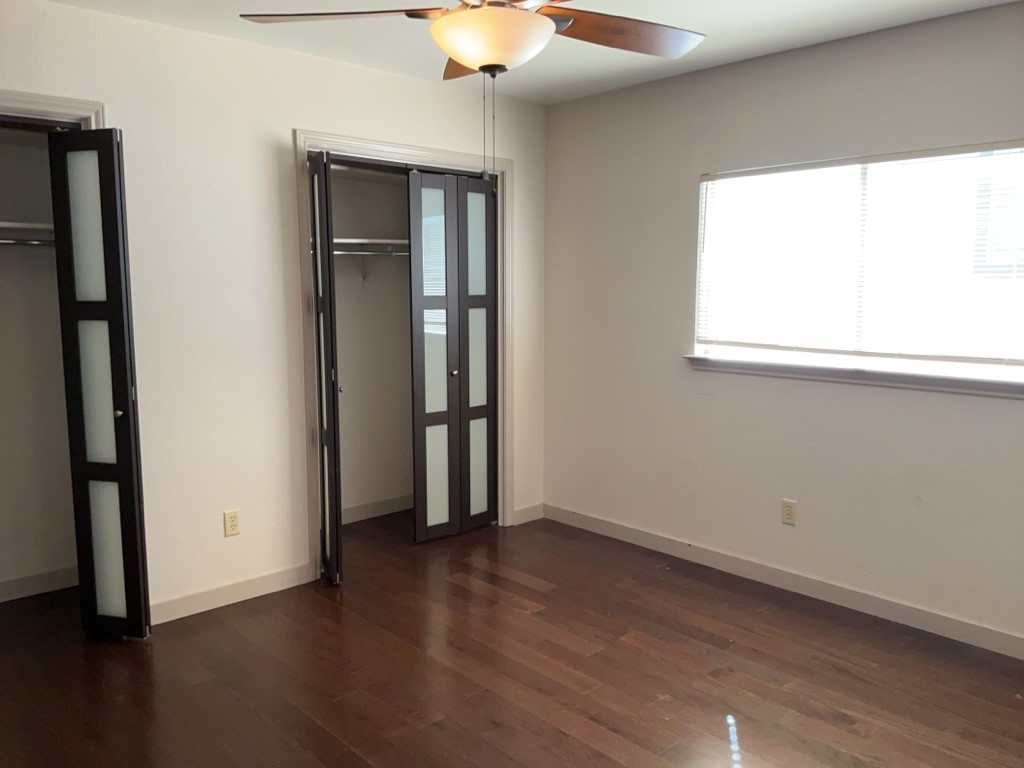 6005 Avery Island Avenue Austin, TX 78727 - Photo 15 of 20 an empty room with wooden floor and a window