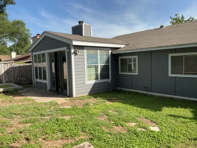 a house view with a garden space