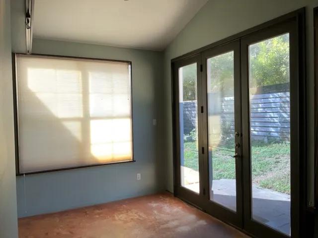a view of an empty room with a window
