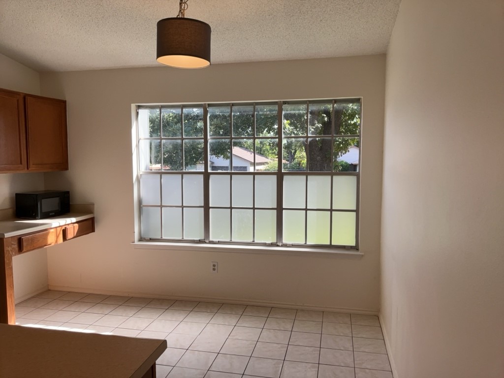 6005 Avery Island Avenue Austin, TX 78727 - Photo 9 of 20 a view of an empty room with a window