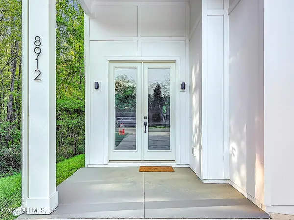 a view of wooden floor and closet in a room