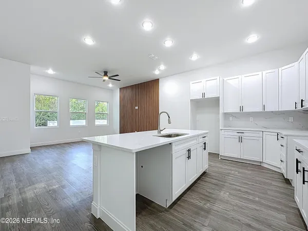 a kitchen with a sink and cabinets