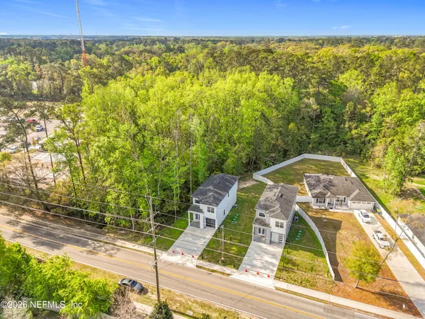 a aerial view of a house with a yard