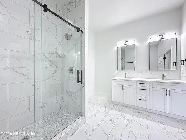 a view of a bathroom with wooden floor