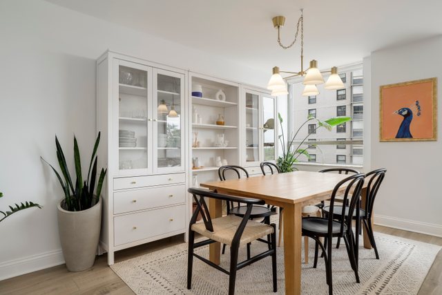5701 North Sheridan Road, Unit 4R Chicago, IL 60660 - Photo 6 of 18 a view of a dining room with furniture and window