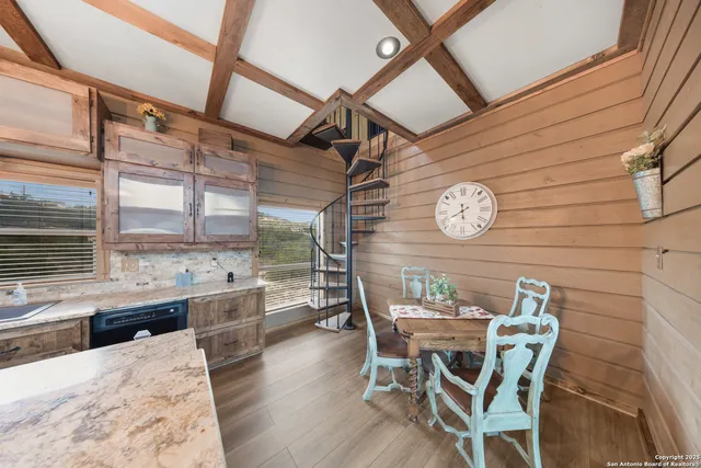a bedroom with furniture and natural light