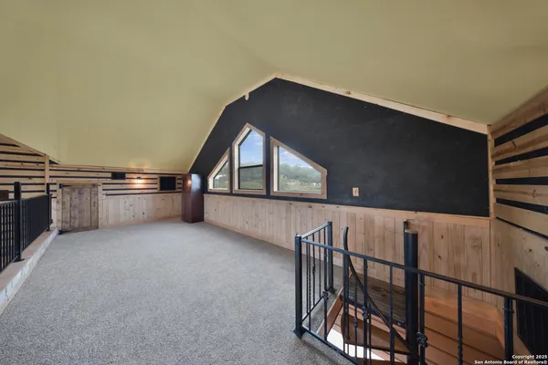 a living room with furniture a ceiling fan and a window