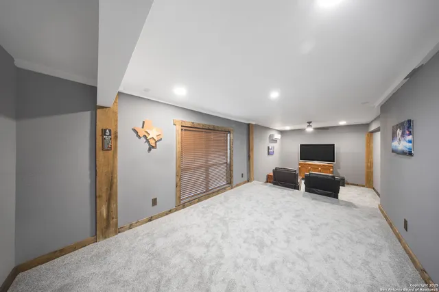 a view of a balcony with couches and table and chairs