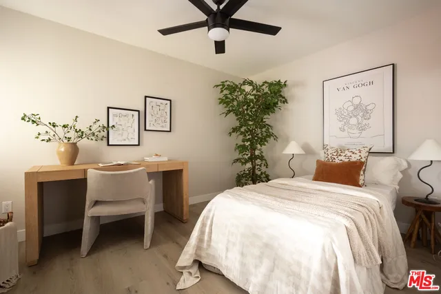 a bedroom with a bed and a table