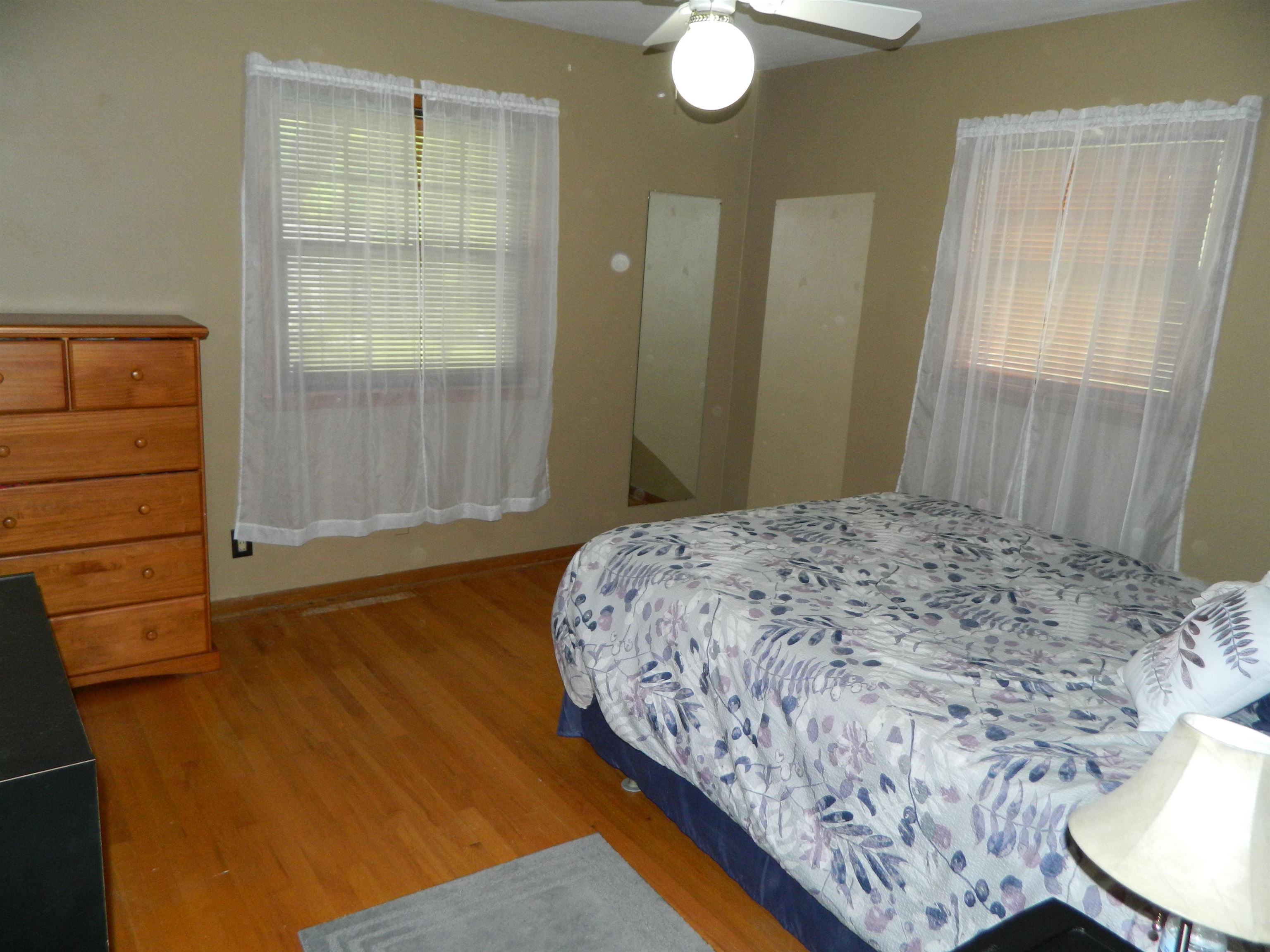 3834 Abbotsford Road Rockford, IL 61107 - Photo 13 of 25 a bedroom with a bed and a window