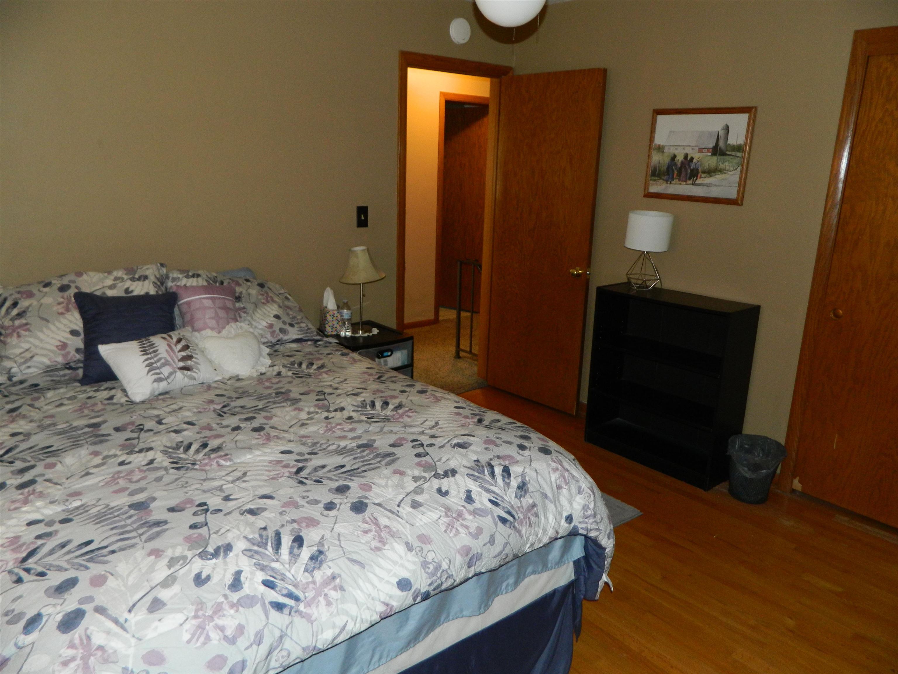 3834 Abbotsford Road Rockford, IL 61107 - Photo 14 of 25 a bedroom with a bed and a dresser