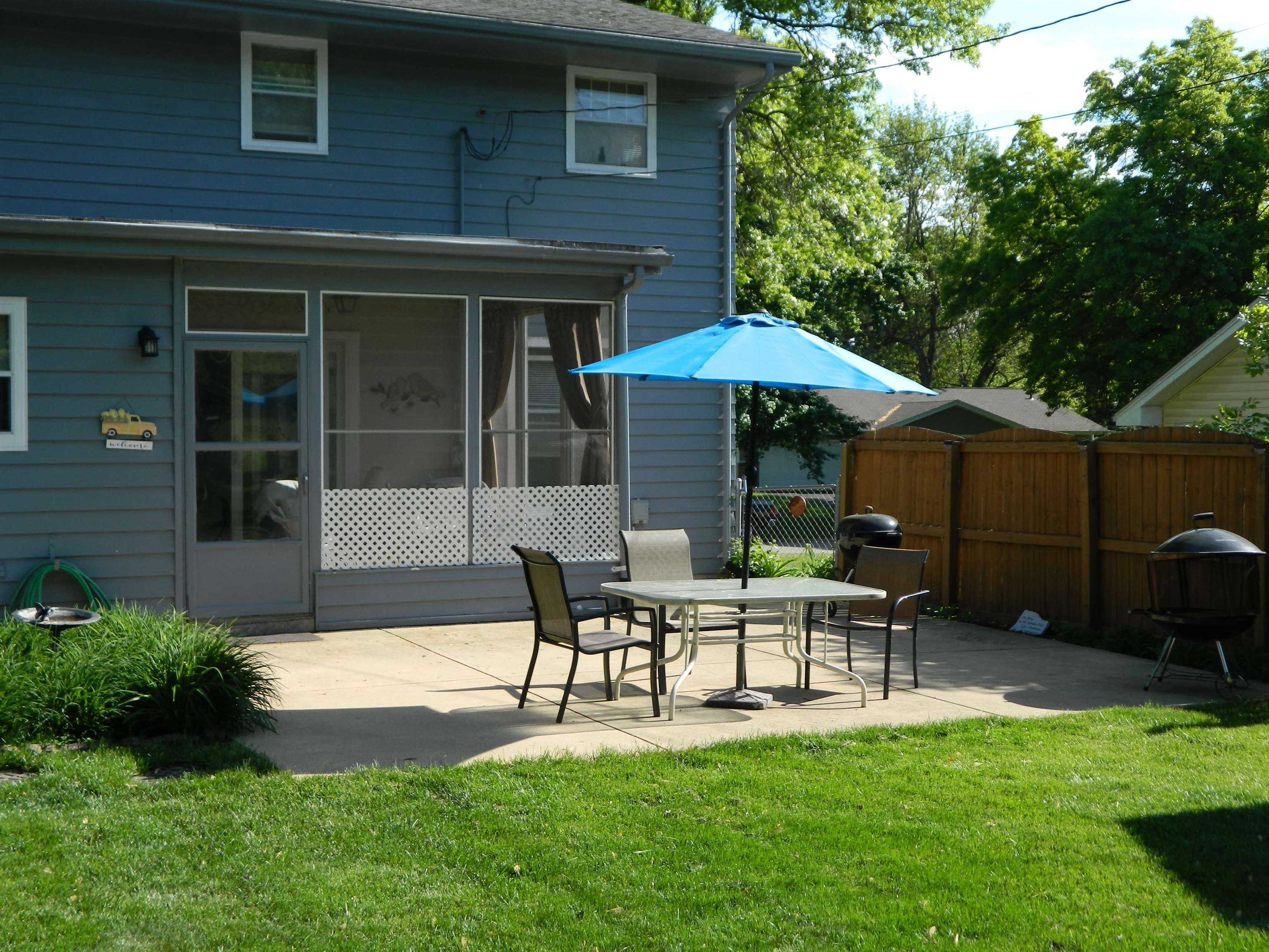 3834 Abbotsford Road Rockford, IL 61107 - Photo 25 of 25 a wooden bench sitting in front of a house