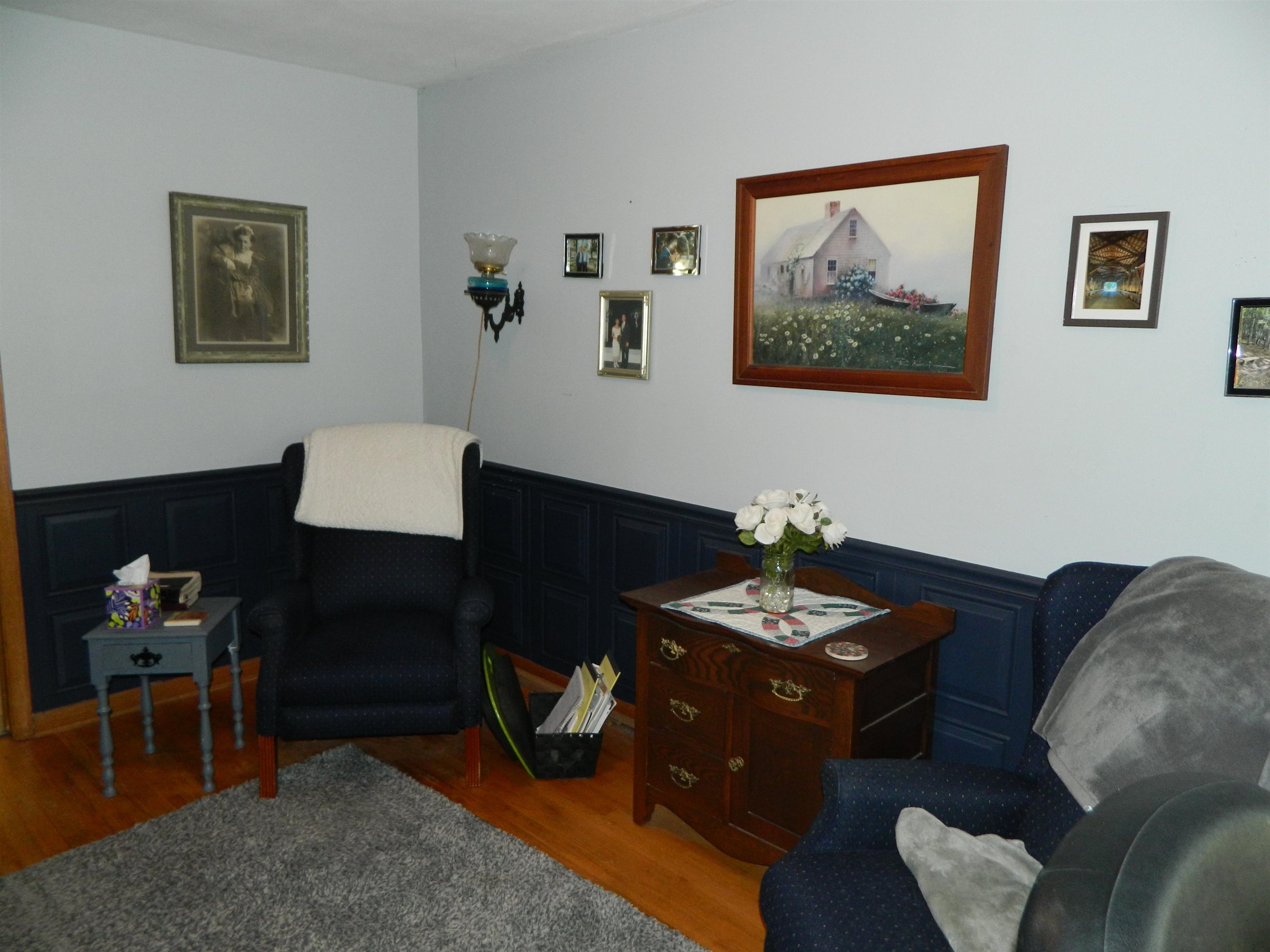 3834 Abbotsford Road Rockford, IL 61107 - Photo 3 of 25 a living room with furniture and a lamp