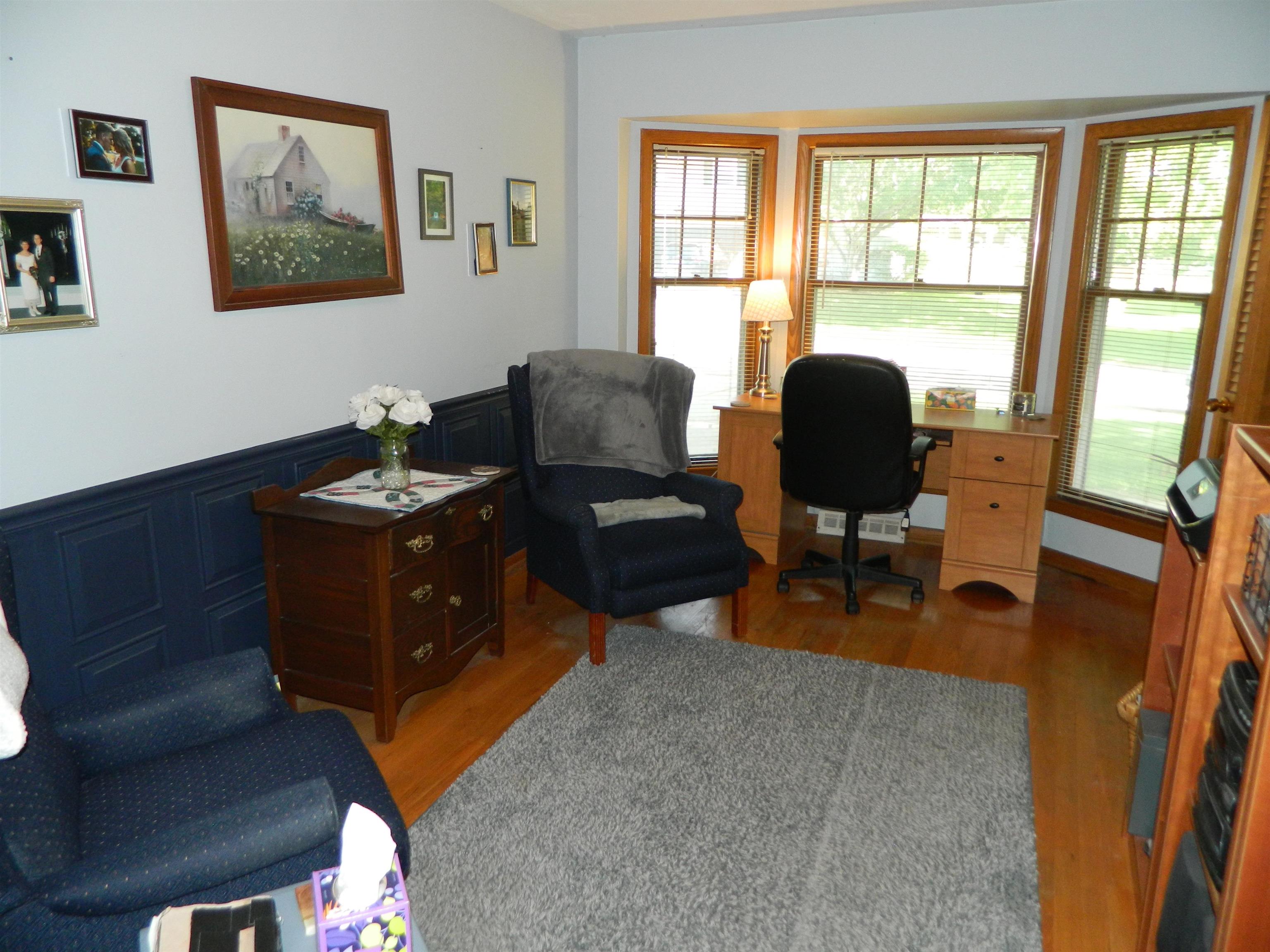 3834 Abbotsford Road Rockford, IL 61107 - Photo 4 of 25 a living room with furniture rug and a window