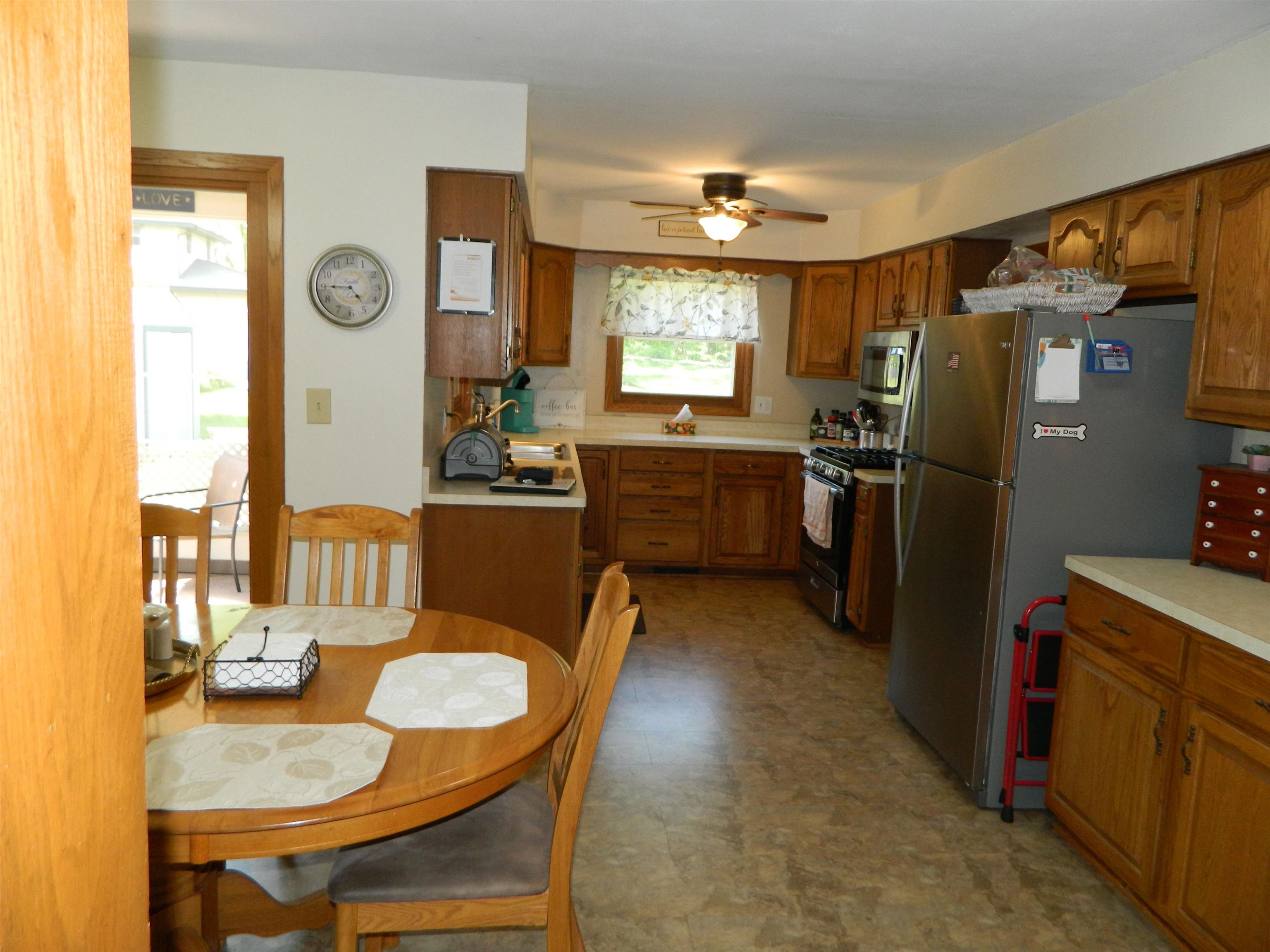 3834 Abbotsford Road Rockford, IL 61107 - Photo 6 of 25 a living room with stainless steel appliances granite countertop furniture and a window