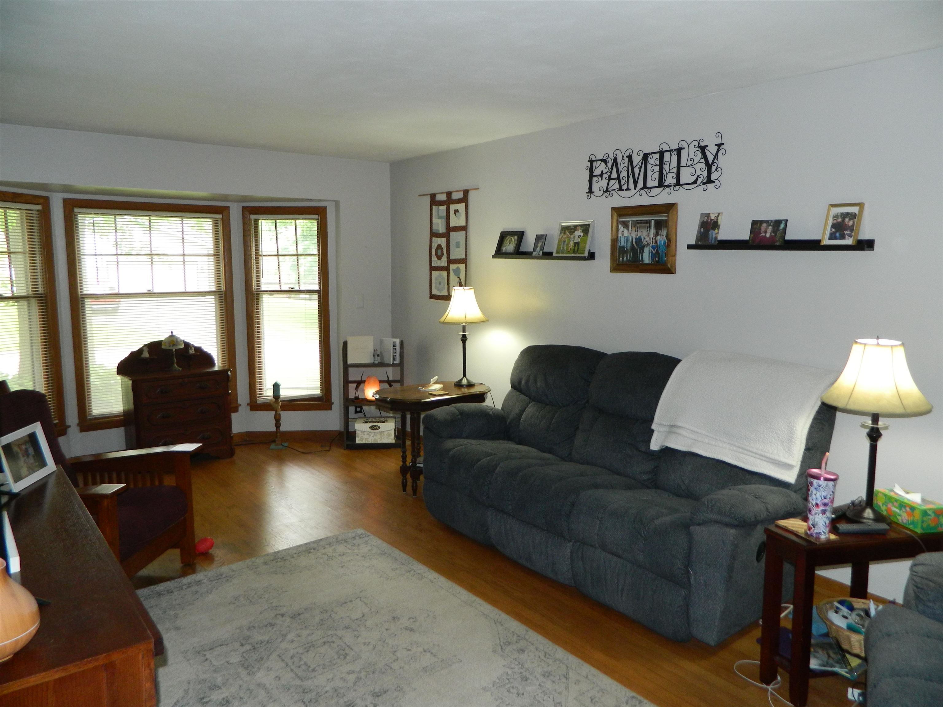 3834 Abbotsford Road Rockford, IL 61107 - Photo 7 of 25 a living room with furniture and a flat screen tv