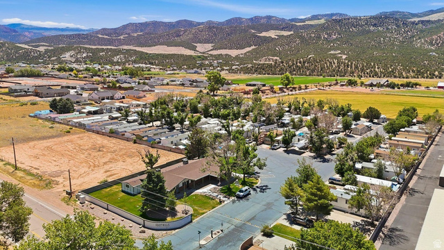 416 Kari Parowan, UT 84761 - Photo 11 of 14 Aerial perspective showcasing expansive land parcels, bordering established residential areas and a mobile home park