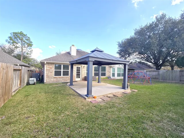 a front view of a house with a yard and porch