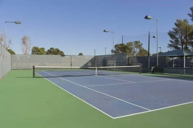 a view of a swimming pool with a patio