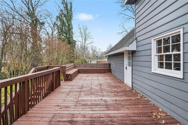 a view of wooden balcony and front door