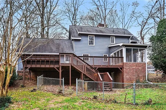 a view of house with a yard