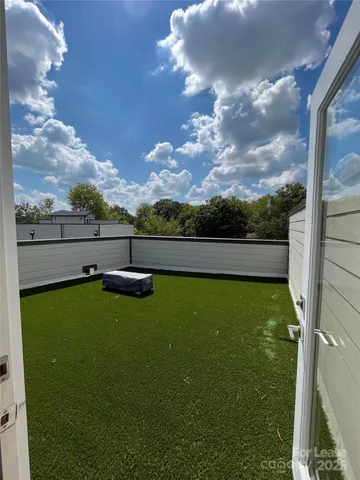 a view of a backyard with mountain view and a lake view