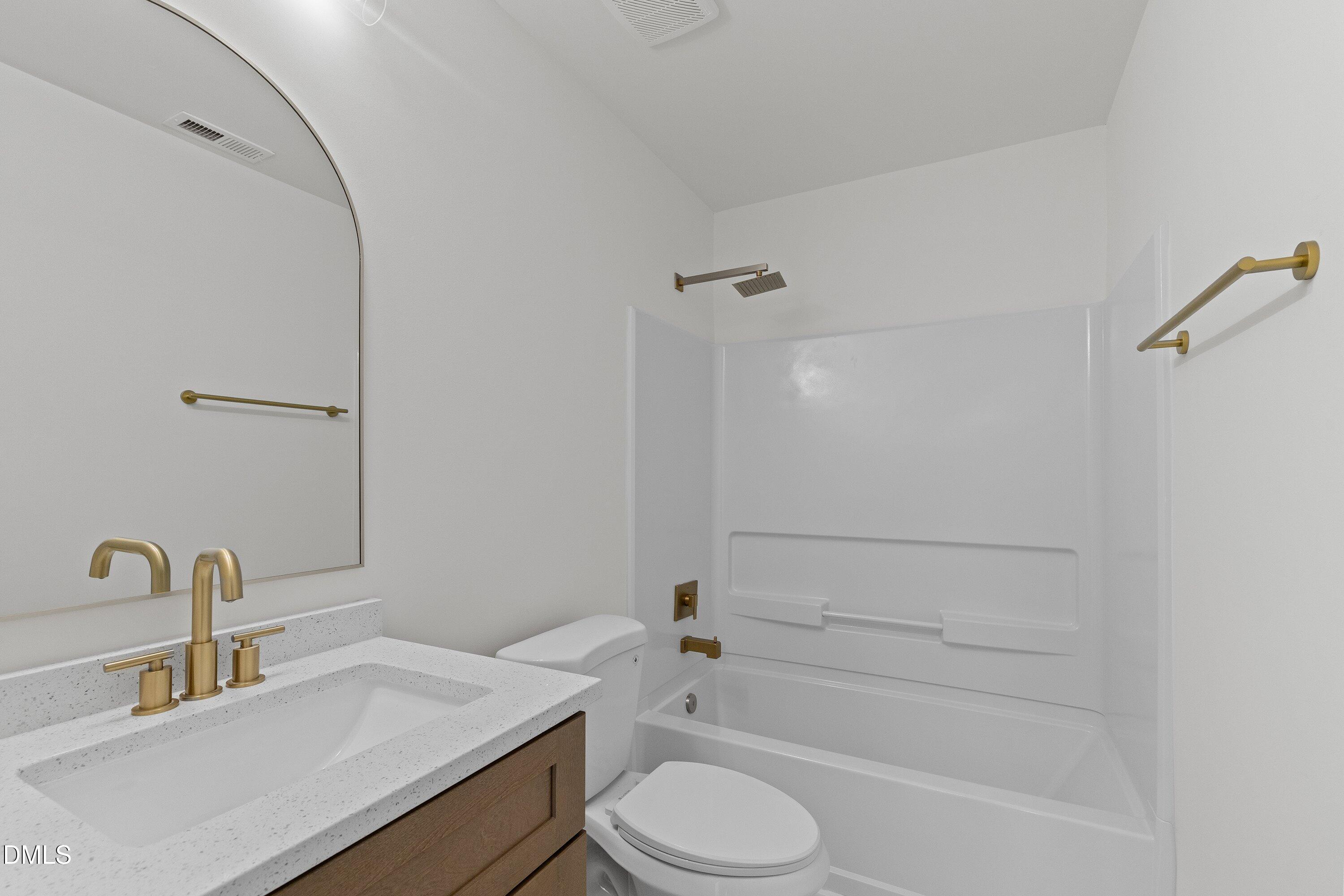 103 Callaway Lane Selma, NC 27576 - Photo 13 of 43 a bathroom with a sink toilet and shower