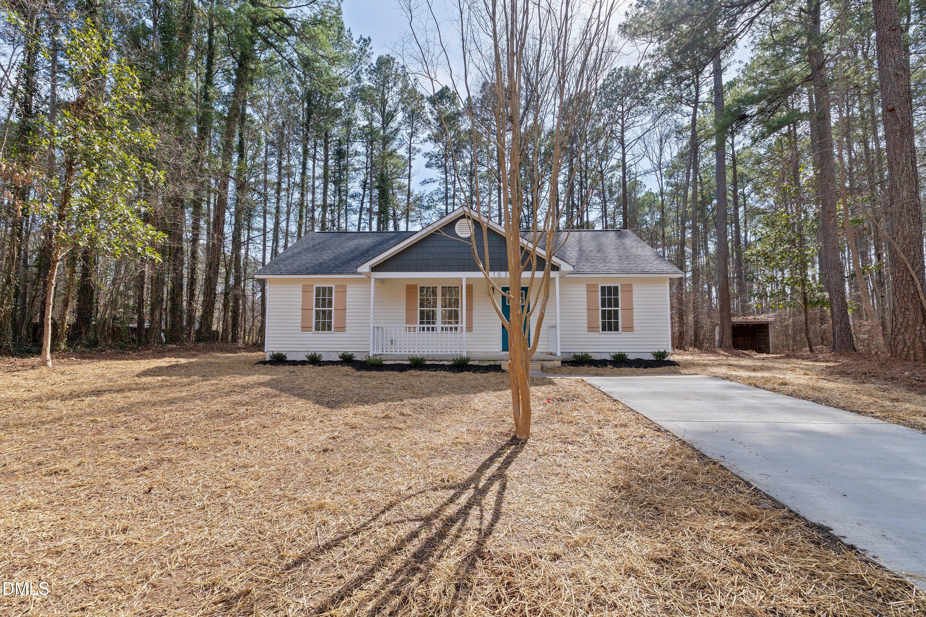 103 Callaway Lane Selma, NC 27576 - Photo 31 of 43 a front view of a house with a yard