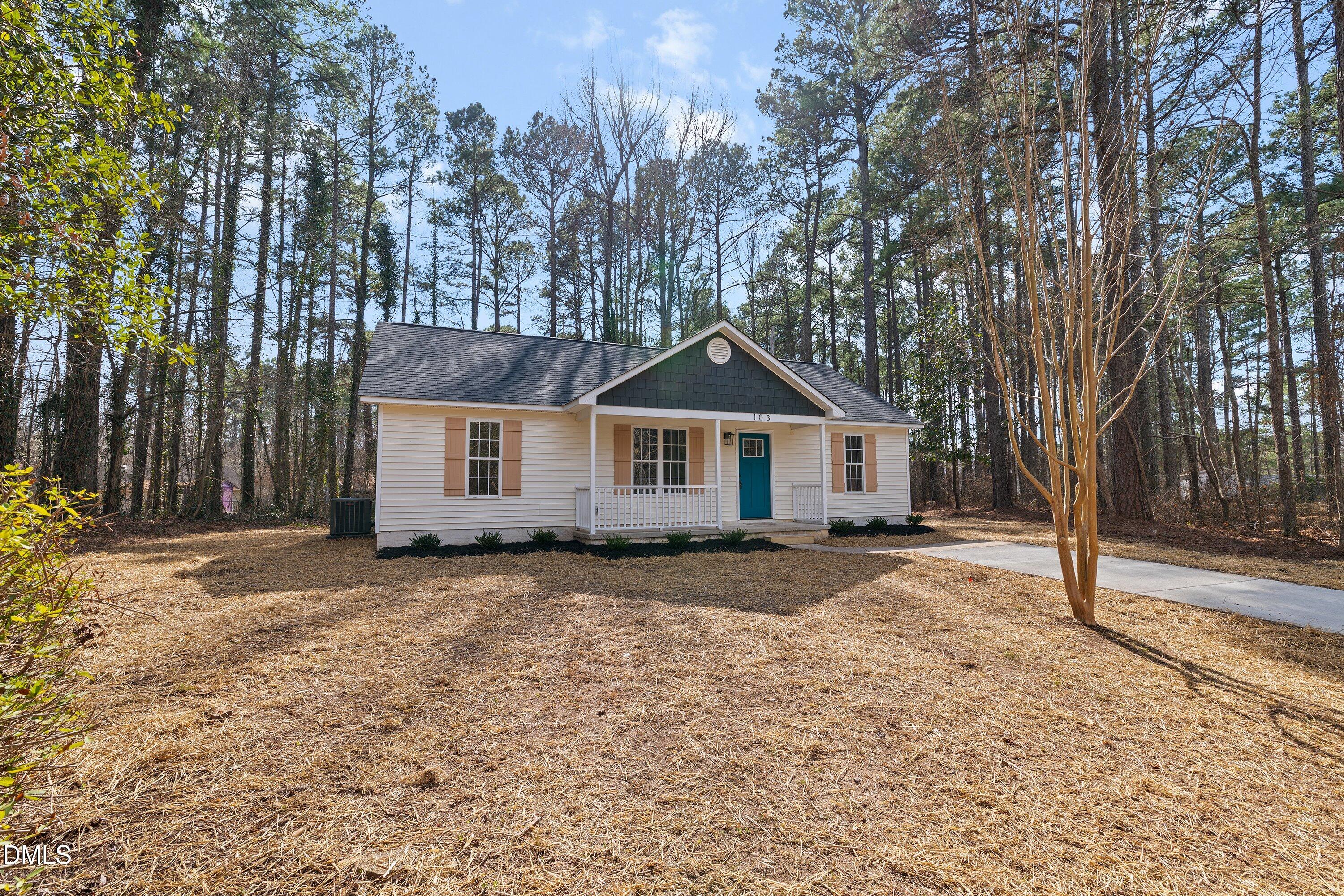 103 Callaway Lane Selma, NC 27576 - Photo 33 of 43 a front view of a house with a yard