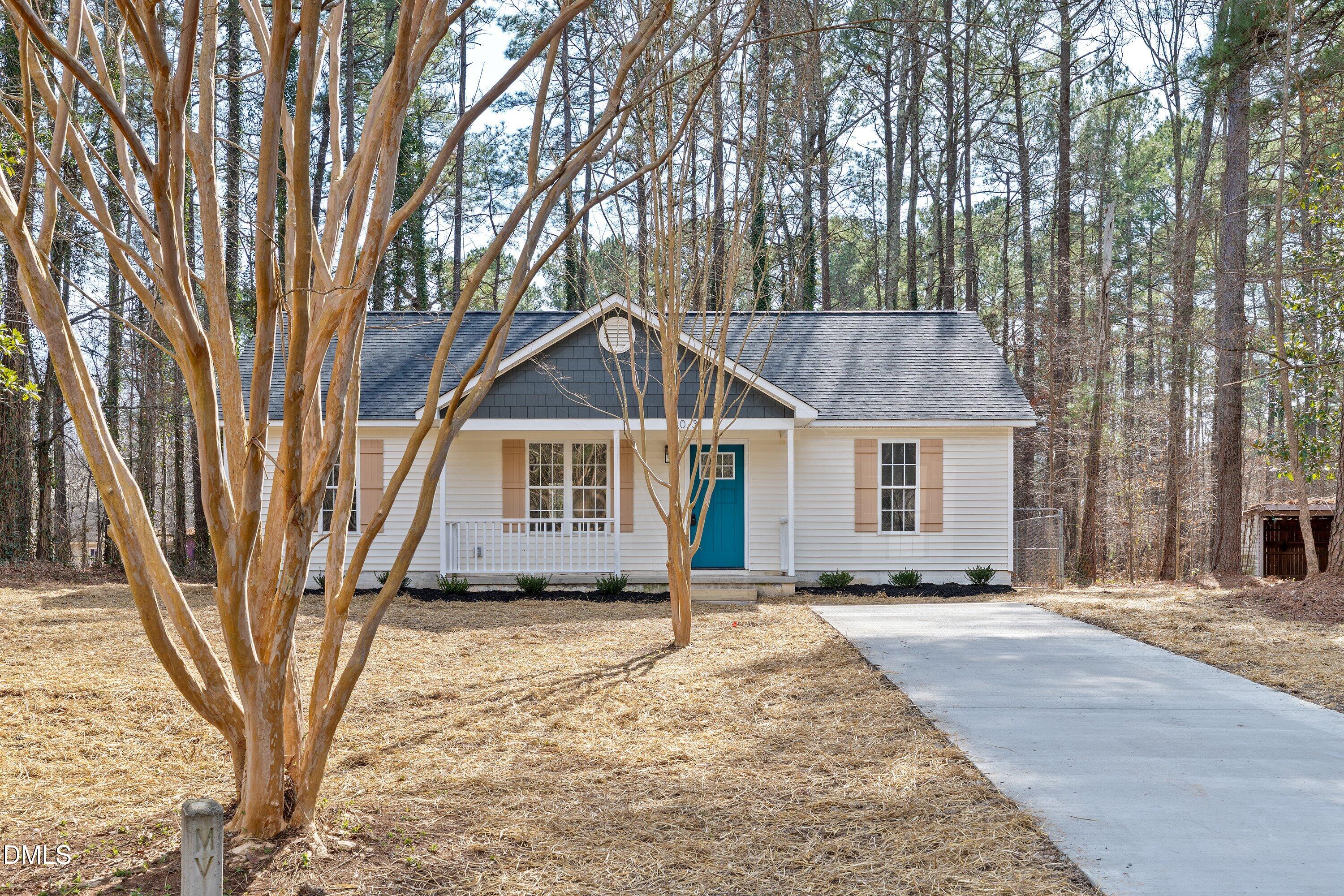 103 Callaway Lane Selma, NC 27576 - Photo 34 of 43 a view of a house with a yard