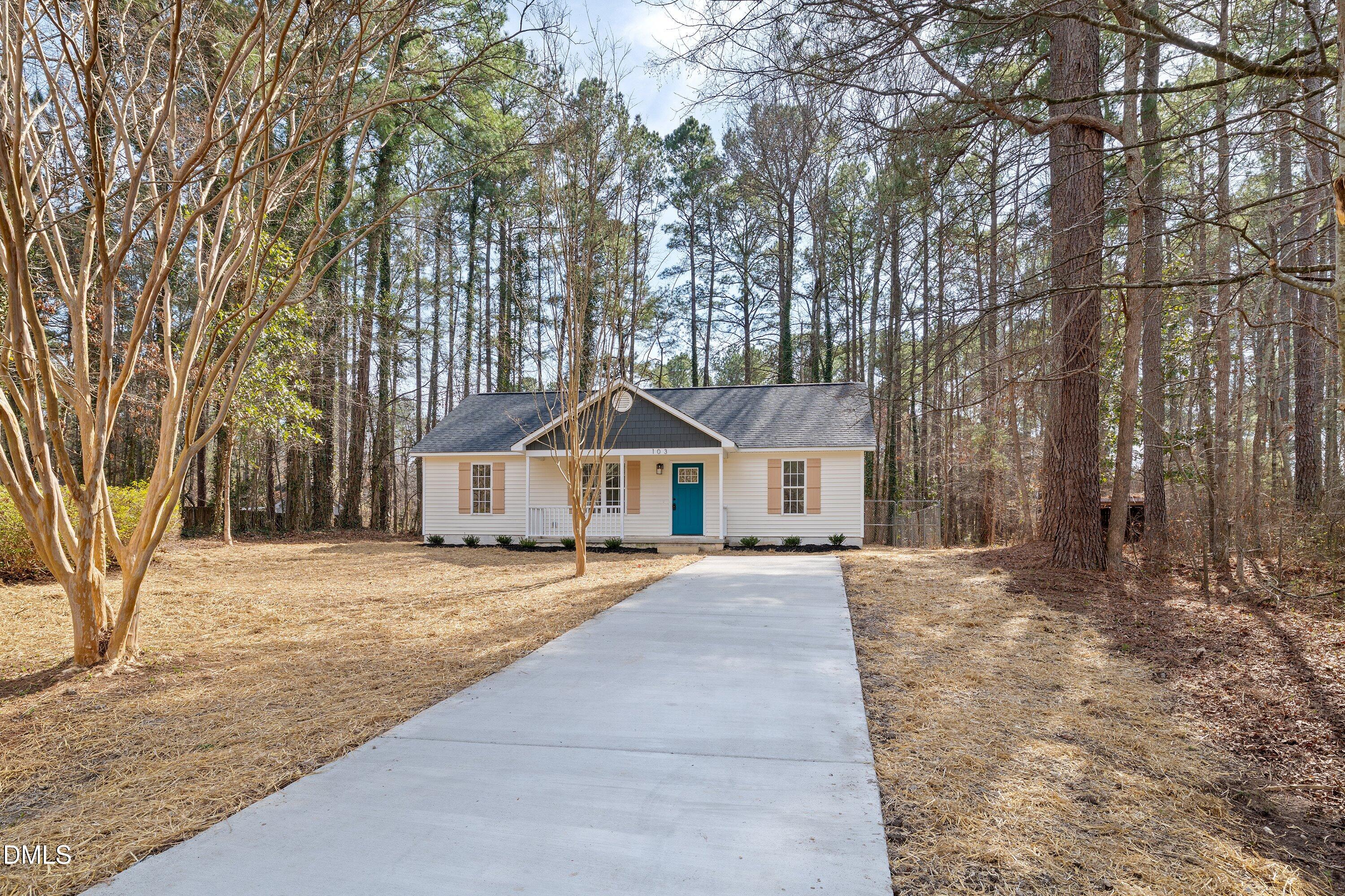103 Callaway Lane Selma, NC 27576 - Photo 35 of 43 front view of a house with a yard covered in snow