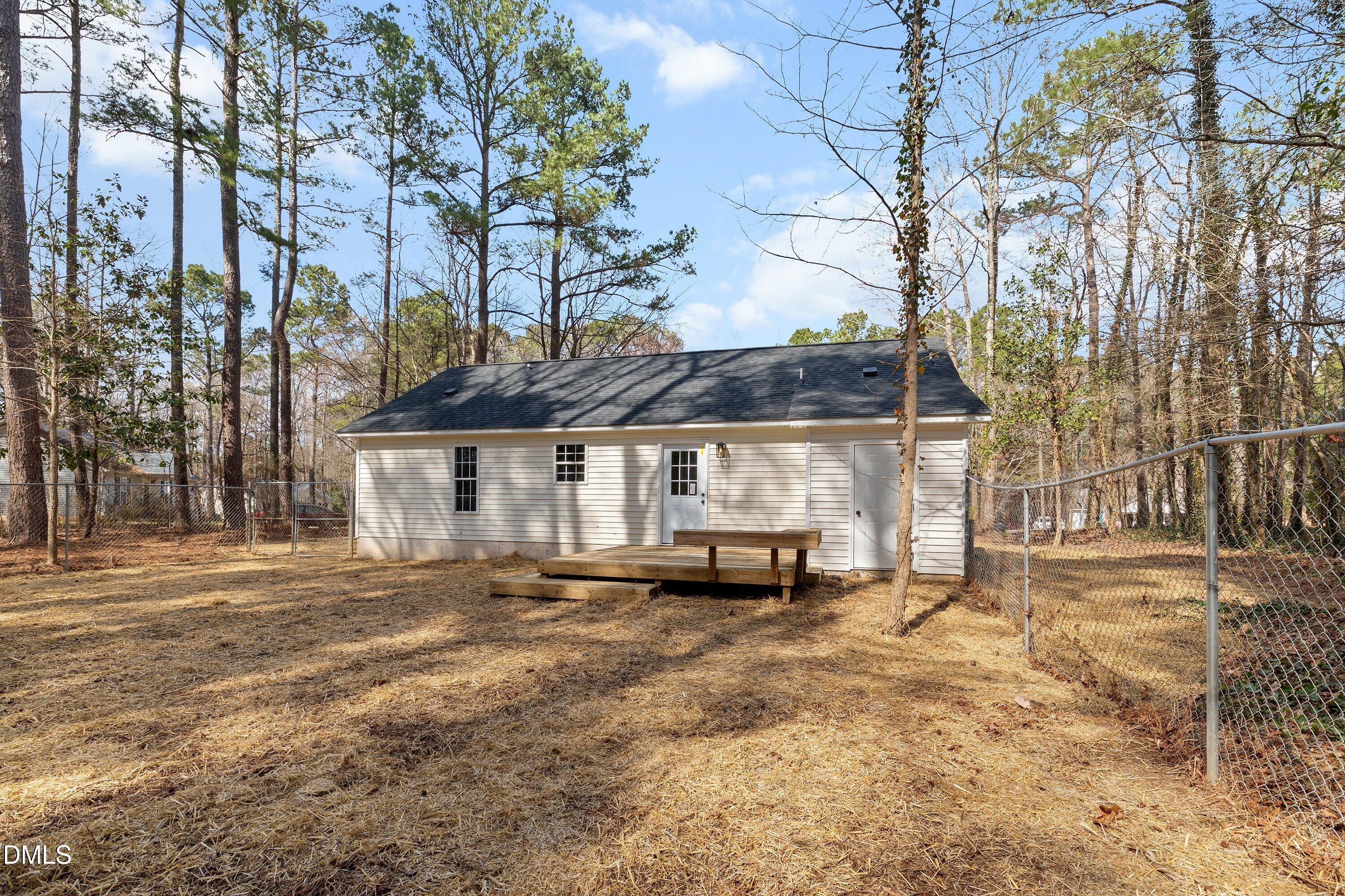 103 Callaway Lane Selma, NC 27576 - Photo 39 of 43 a view of a house with a yard and sitting area
