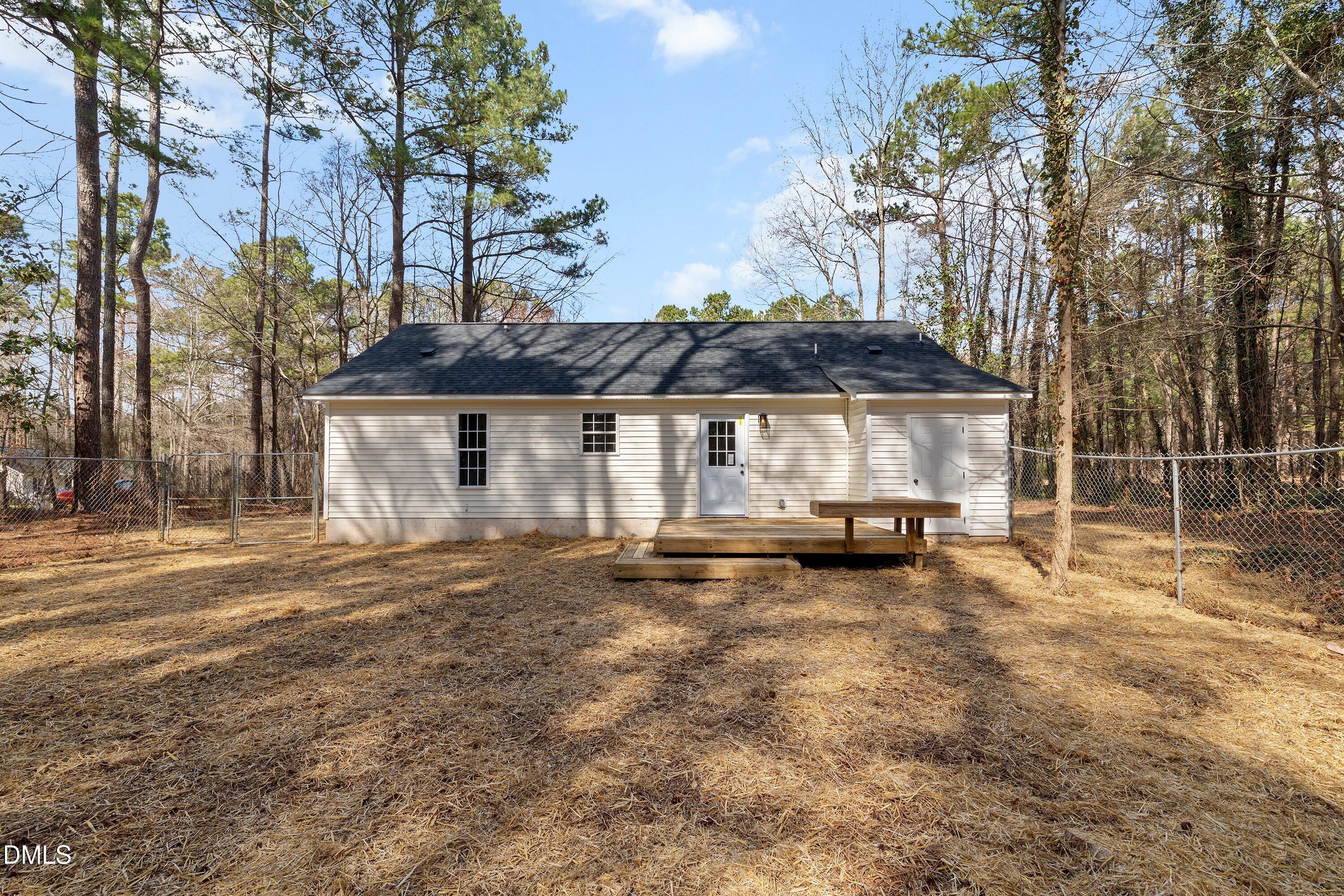 103 Callaway Lane Selma, NC 27576 - Photo 40 of 43 a view of a house with backyard and sitting area