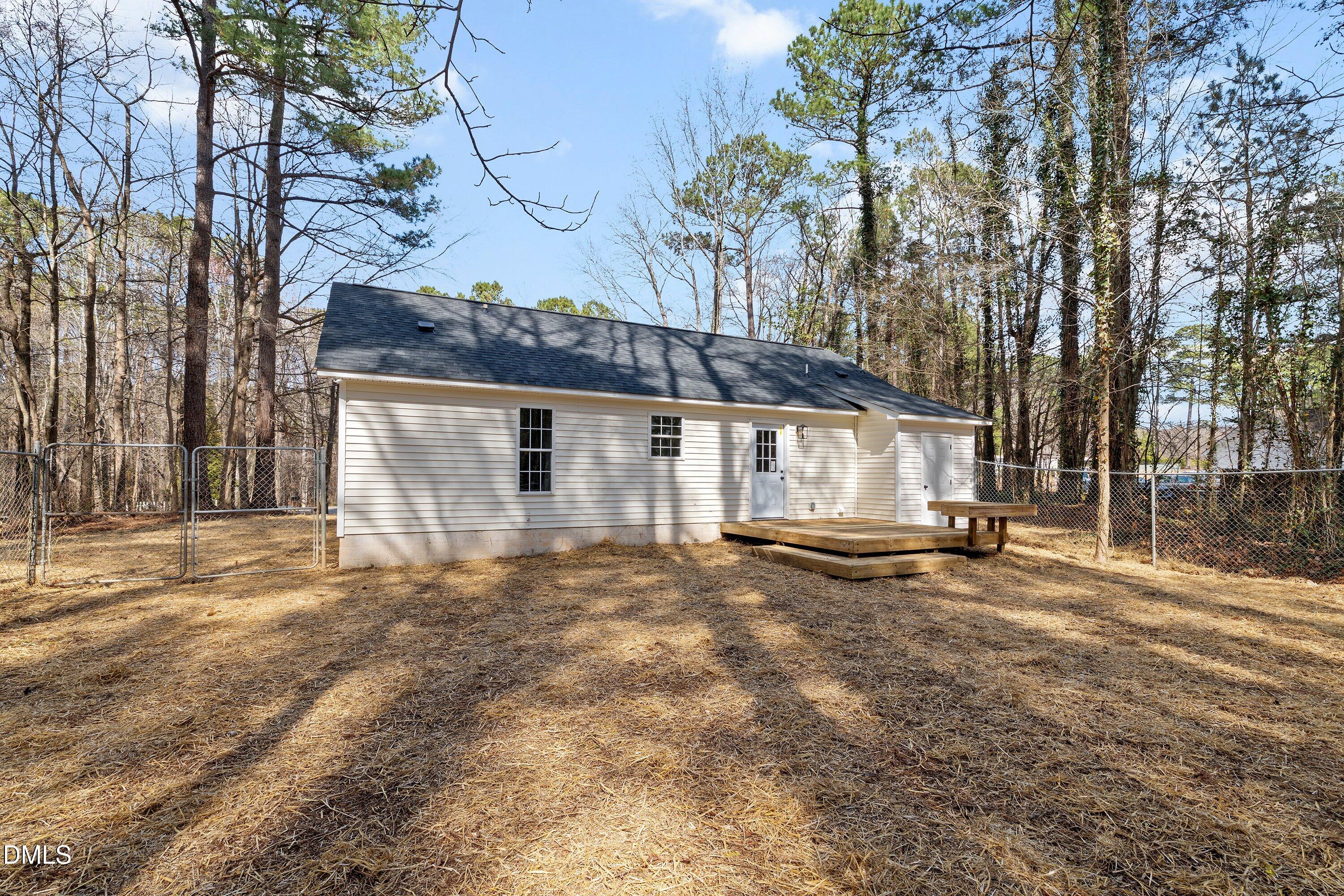 103 Callaway Lane Selma, NC 27576 - Photo 41 of 43 a view of a house with a yard and tree