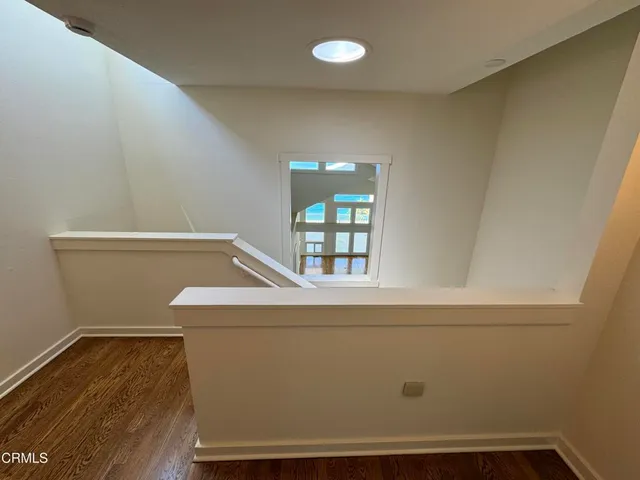 a view of an entryway with wooden floor