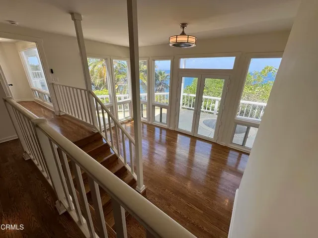 a view of a balcony with a tree