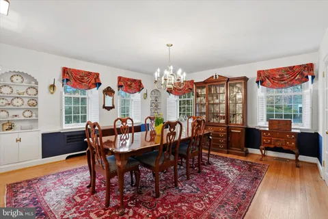 a kitchen with granite countertop a sink stainless steel appliances and cabinets