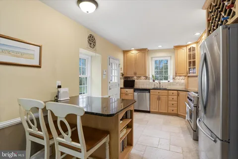 a view of a livingroom with furniture and entryway