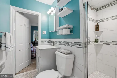 a bedroom with a bed and lamp