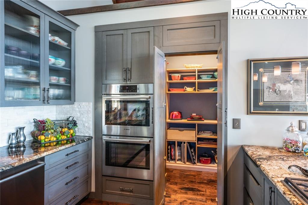 756 Saddle Road Vilas, NC 28692 - Photo 11 of 32 a kitchen with stainless steel appliances granite countertop a stove and a refrigerator