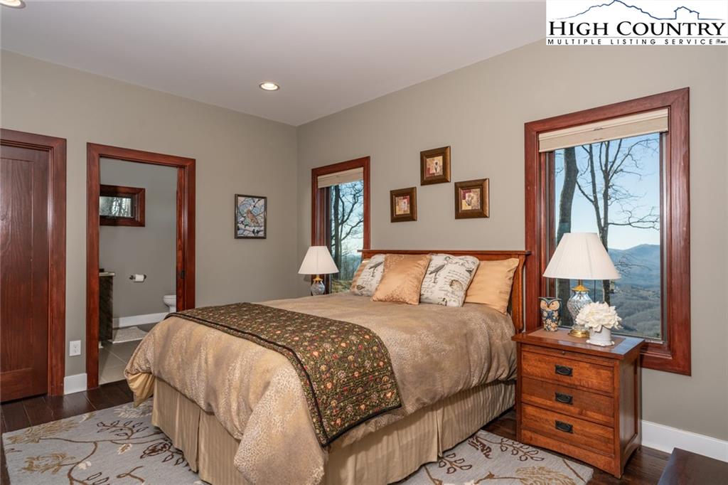 756 Saddle Road Vilas, NC 28692 - Photo 17 of 32 a bedroom with bed and a window