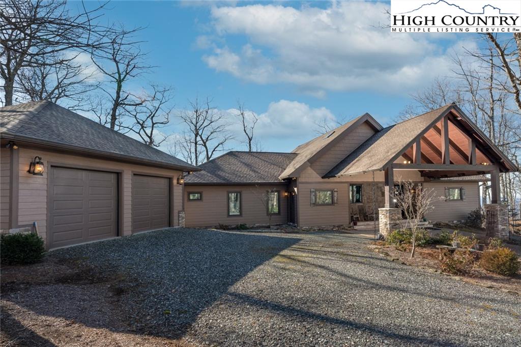 756 Saddle Road Vilas, NC 28692 - Photo 28 of 32 a front view of a house with a yard