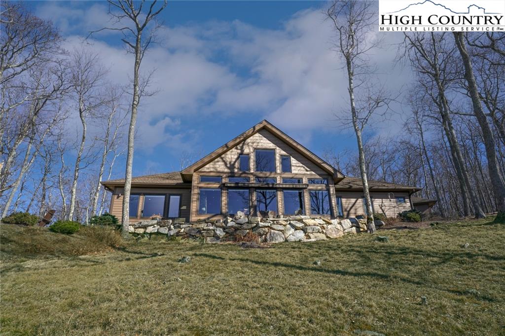 756 Saddle Road Vilas, NC 28692 - Photo 30 of 32 a front view of a house with a yard