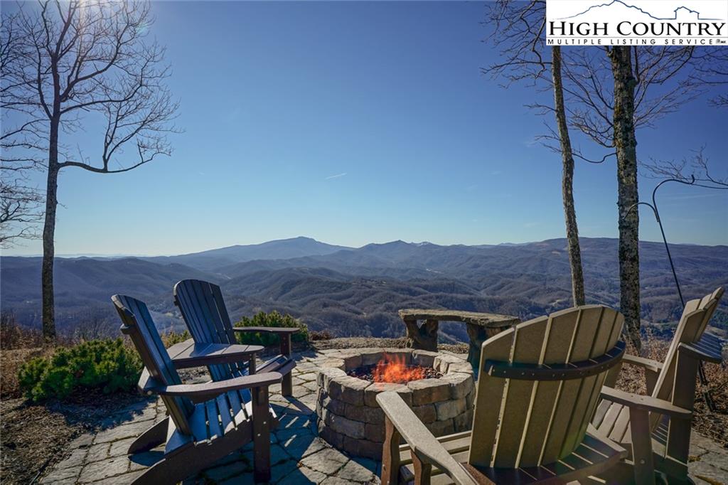 756 Saddle Road Vilas, NC 28692 - Photo 5 of 32 a view of backyard with barbeque grill and outdoor seating
