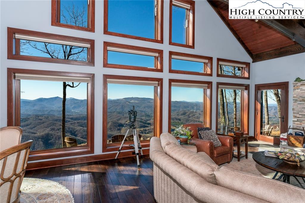 756 Saddle Road Vilas, NC 28692 - Photo 7 of 32 a living room with furniture tv and a large window