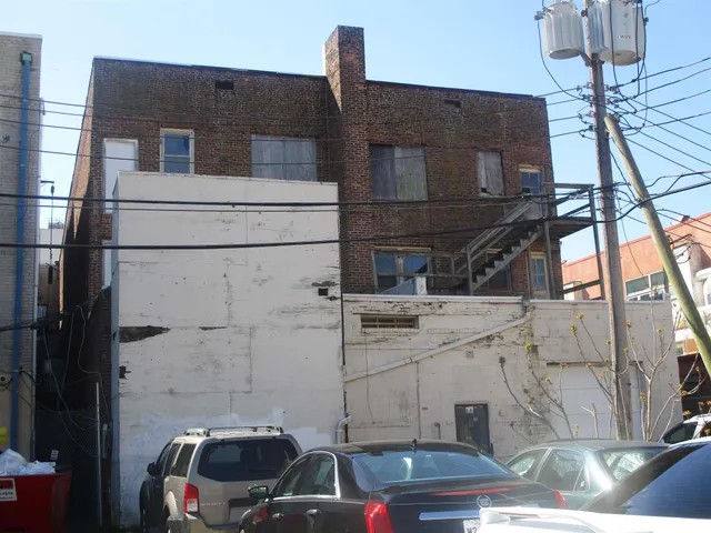 a front view of a house with parking space