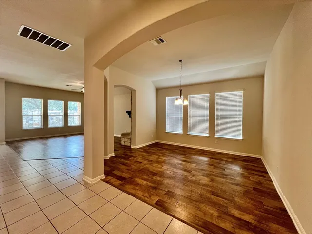 a kitchen with granite countertop a sink a counter top space appliances and cabinets