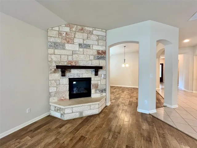 a large kitchen with stainless steel appliances lots of counter top space cabinets and a view of kitchen