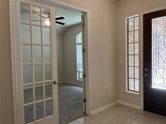 a view of a room with windows and closet